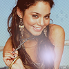 vanessa hudgens with her necklace holding it wow that