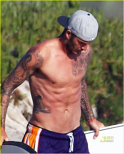  David Beckham: Shirtless Surfing with a Bodyguard