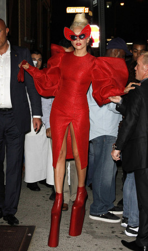  Gaga shows off a little lebih than she'd hoped in a red crotch revealing outfit.