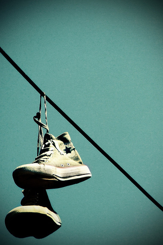 Chucks hanging from telephone wires