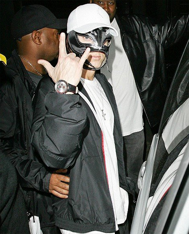  Eminem wearing an official Rey Mysterio mask