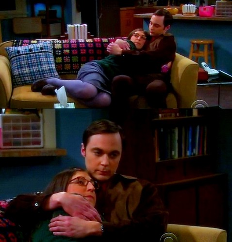  Sheldon and Amy hug.