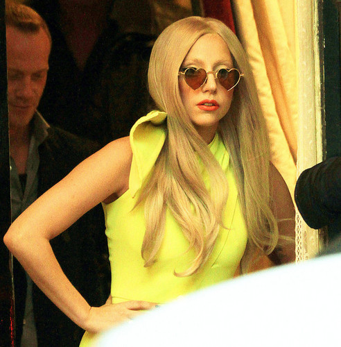  Lady Gaga greets her fans before she leaves the Lanesborough Hotel in London.