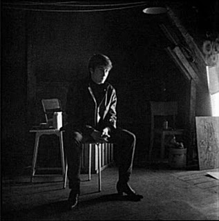  John Lennon sitting in Stu's work area