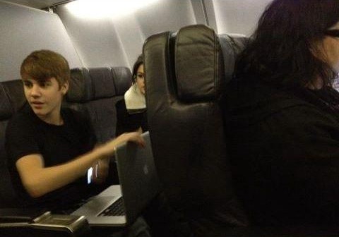  Justin and Selena sitting in a airplane