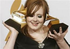 Adele Playing with Trophies
