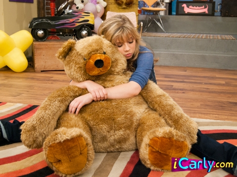 Sam holding a teddy bear