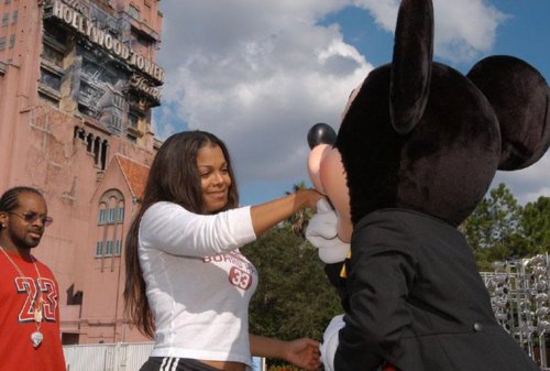 Mickey kissing Janet's hand