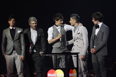  1D on stage collecting their BRIT award!