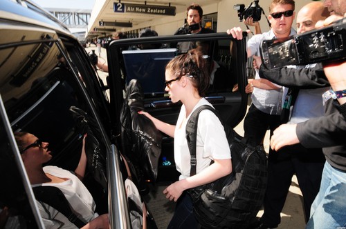 Kristen Stewart & Robert Pattinson at LAX airport in Los Angeles, California - March 8, 2012.