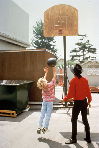 Macaulay Culkin playing basketball with Michael Jackson