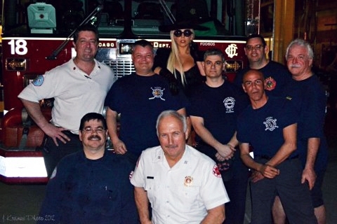 Lady Gaga with the fire department in Chicago yesterday
