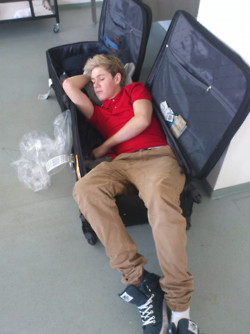  Niall sleeping in a suitcase