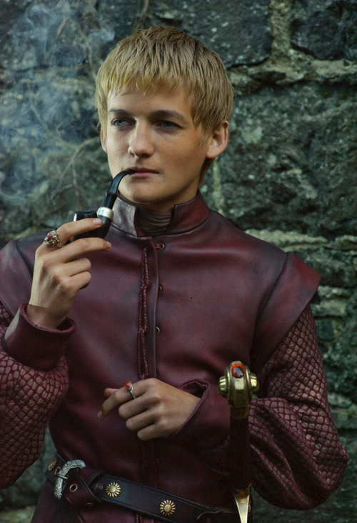 Jack Gleeson smoking a pipe on the set of Game of Thrones