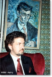  Bill Harry with the portrait Stuart Sutcliffe painted of him