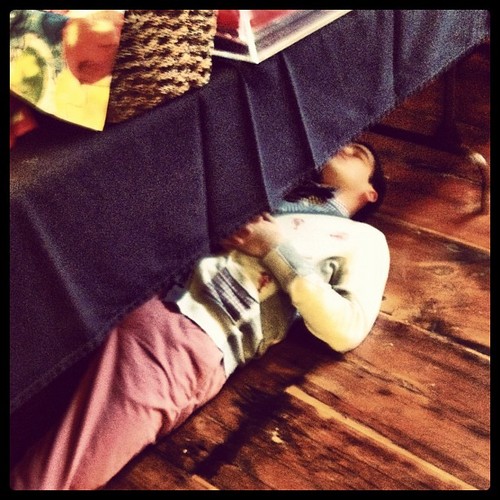 Darren napping under table on the Glee set