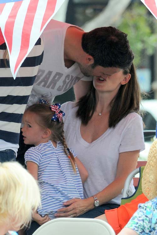 Ben and Jen with their 3 kids watch 4th of july parede
