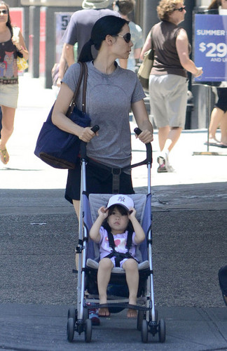  Lucy Liu Strolls Through NYC with a Young Family Member [June 30]