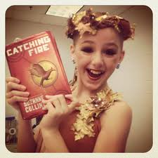 Chloe holding Catching Fire
