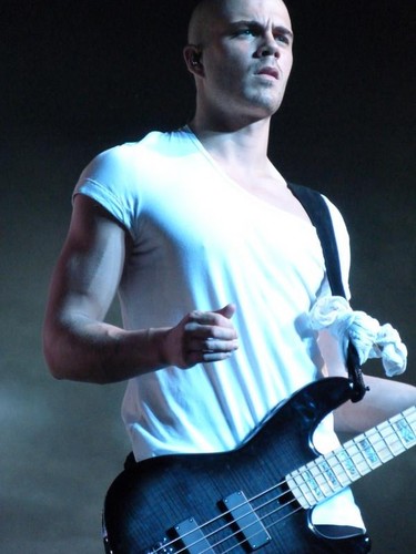 Max George Playing guitar