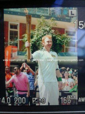  Rupert Grint carrying the Olympic Torch.