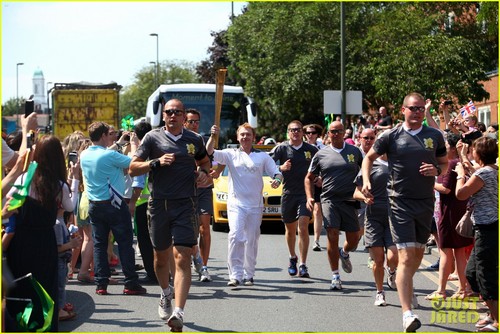  Rupert Grint carring the Olympics Torch