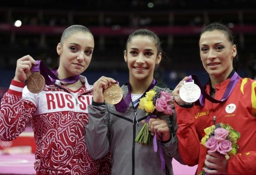Aly Raisman wins gold in olympic floor after bronze in beam.