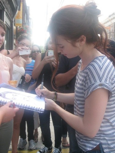  Lily signing autographs on the set of cite of Bones