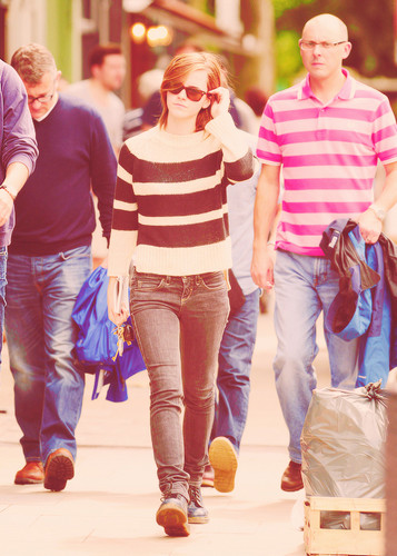 Emma leaving a library in London with boyfriend Will