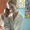Emma adoring a local baby in Bangladesh TheLogicalwitch photo